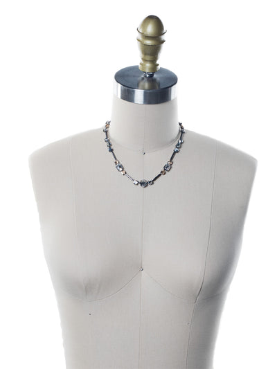 Poppy Tennis Necklace - NEN18GMGNS - The Poppy Tennis Necklace is anything but ordinary. Wear it all when you combine classic, baguette and navette sparklers. It's structured and sophisticated. From Sorrelli's Golden Shadow collection in our Gun Metal finish.