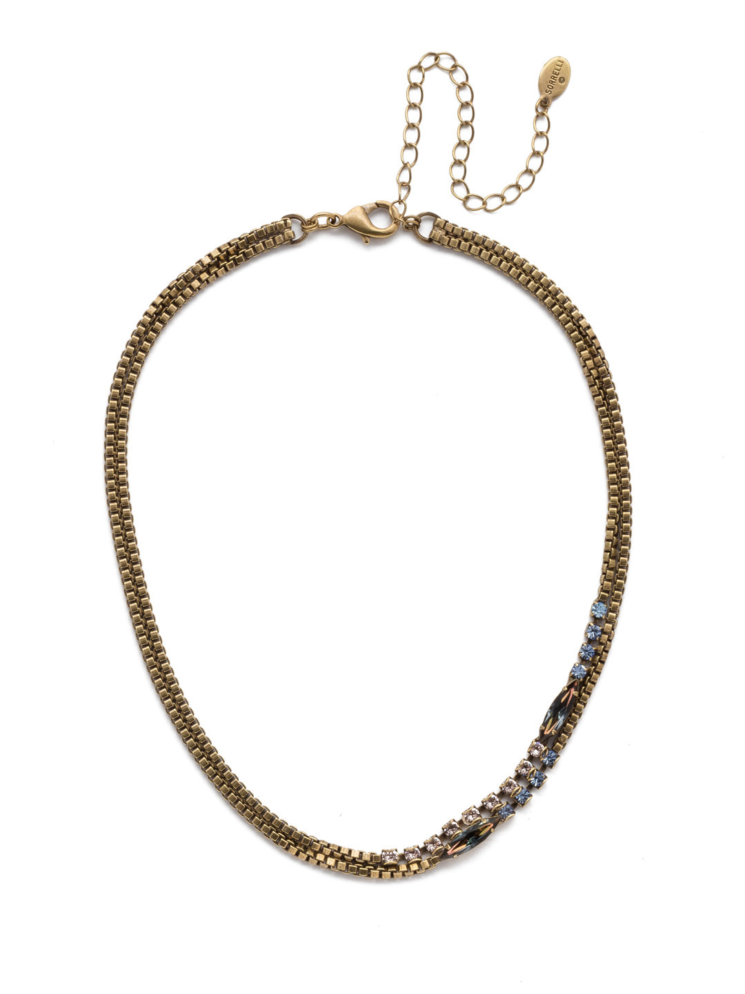 Banks Tennis Necklace - NEP11AGSDE - <p>Looking to layer on some edge? The Banks Tennis Necklace is a great place to start. A double-loop of chain metal is partially-encrusted in both round and navette sparkling crystals. From Sorrelli's Selvedge Denim collection in our Antique Gold-tone finish.</p>