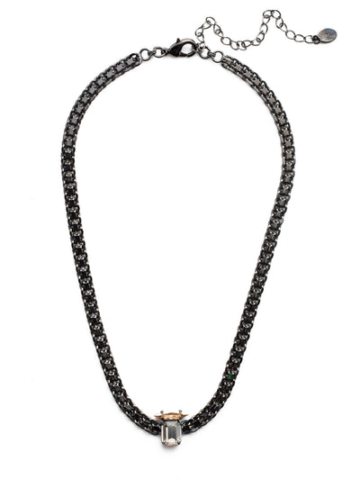 Graycen Tennis Necklace - NEP15GMGNS - Metal rules in the Graycen Tennis Necklace. Layer on thick, dark standout links complemented by a cushion octagon and navette crystal sparkler. From Sorrelli's Golden Shadow collection in our Gun Metal finish.