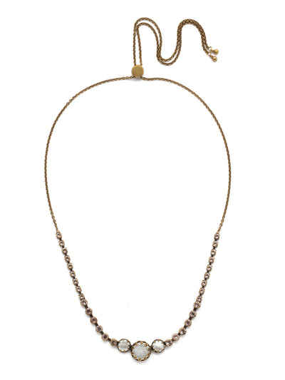 Katarina Tennis Necklace - NEP2AGSDE - <p>Perfectly pretty, that's the Katarina Tennis Necklace. Adjust its tried-and-true trio of pearls surrounding by sparkling round crystals to your desired length and you're good to go. From Sorrelli's Selvedge Denim collection in our Antique Gold-tone finish.</p>
