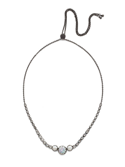 Katarina Tennis Necklace - NEP2GMMMO - Perfectly pretty, that's the Katarina Tennis Necklace. Adjust its tried-and-true trio of pearls surrounding by sparkling round crystals to your desired length and you're good to go. From Sorrelli's Midnight Moon collection in our Gun Metal finish.