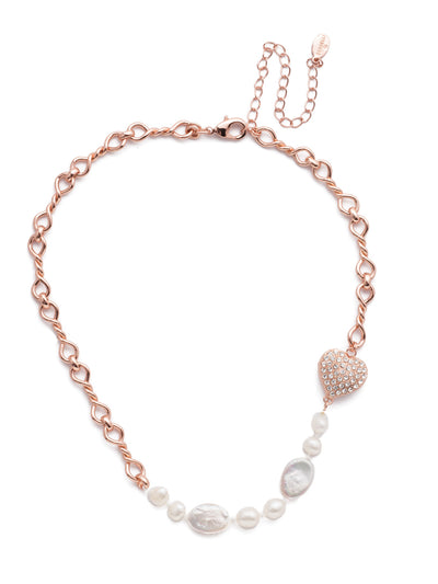 Venus Tennis Necklace - NER10RGCRY - <p>Fasten on the Venus Tennis Necklace for something particularly pretty. Links of metalwork set the stage for an offest row of classic freshwater pearls and a sparkling crystal heart. From Sorrelli's Crystal collection in our Rose Gold-tone finish.</p>