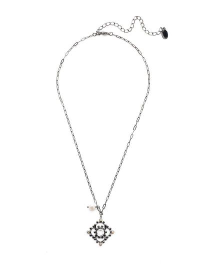 Genesis Pendant Necklace - NES3GMGNS - The Genesis Pendant Necklace is proof that lots of good things can come in a smaller-sized package: hand-soldered metal detail, a clear gem, a pretty pearl, sparkling crystal…it's all there. From Sorrelli's Golden Shadow collection in our Gun Metal finish.