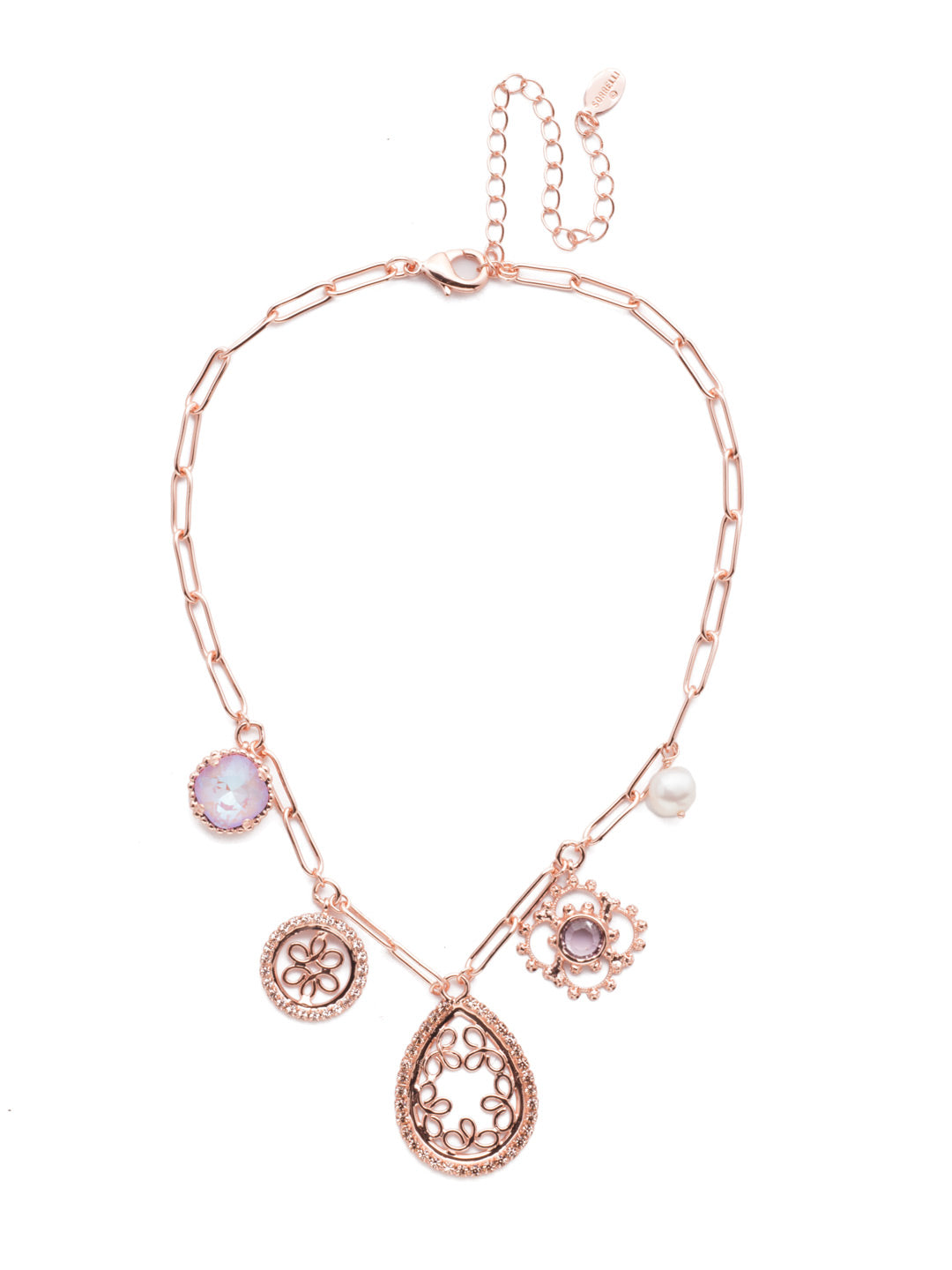 Hudson Statement Necklace - NES4RGLVP - <p>Our Hudson Statement Necklace has a charm bracelet feel. Five standout pieces link to an airy metal chain and feature hand-soldered metalwork, sparkling crystals, a pretty pearl and so much more. From Sorrelli's Lavender Peach collection in our Rose Gold-tone finish.</p>