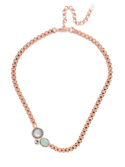 Hartford Tennis Necklace - NET13RGCAZ - The Hartford Tennis Necklace is truly unique. The bold metal chain is offset by an off-center cluster of opaque and sparkling stones and crystals. From Sorrelli's Crystal Azure collection in our Rose Gold-tone finish.