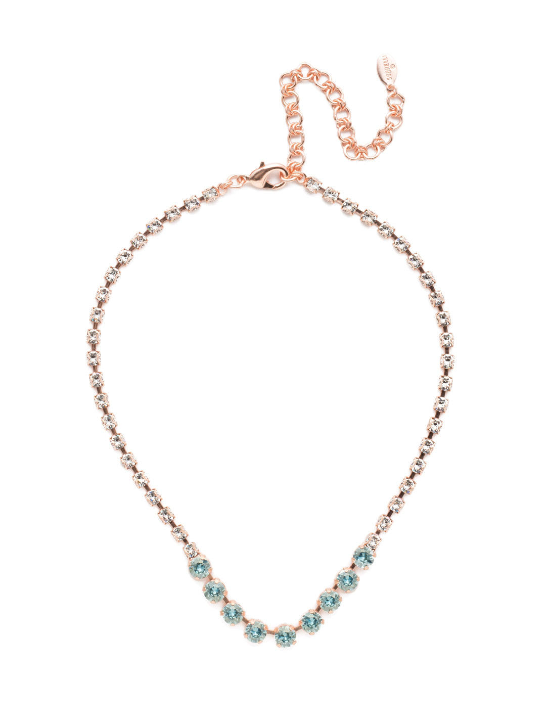 Audriana Tennis Necklace - NET37RGCAZ - The Audriana Tennis Necklace is all about glamour. Shine across any room with the strand entirely encrusted in sparkling crystals, while larger pieces of varying opacities stand front and center. From Sorrelli's Crystal Azure collection in our Rose Gold-tone finish.