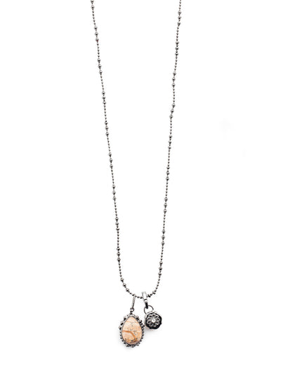 Arizona Pendant Necklace - NEU13GMGNS - Love the charmed look? Get our Arizona Pendant Necklace. A delicate metal chain holds onto a stunning cushion-cut crystal and pear-shaped mineral stone. From Sorrelli's Golden Shadow collection in our Gun Metal finish.
