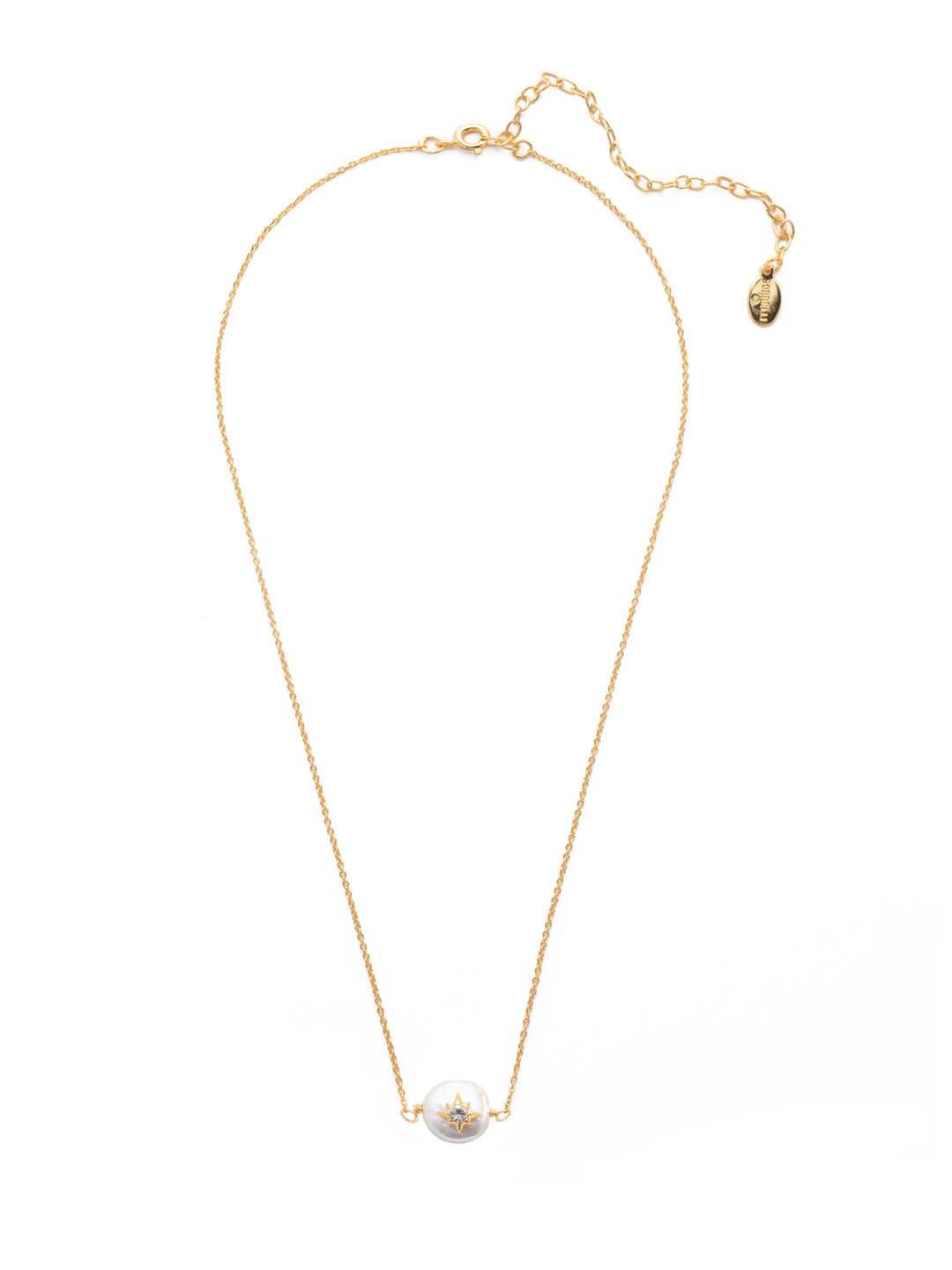 Estella Pendant Necklace - NEV104BGMDP - <p>A single freshwater pearl hosts a metallic star embellished with sparkling crystals. These delicate details sit at the base of a thin adjustable chain, secured with a spring ring clasp. From Sorrelli's Modern Pearl collection in our Bright Gold-tone finish.</p>