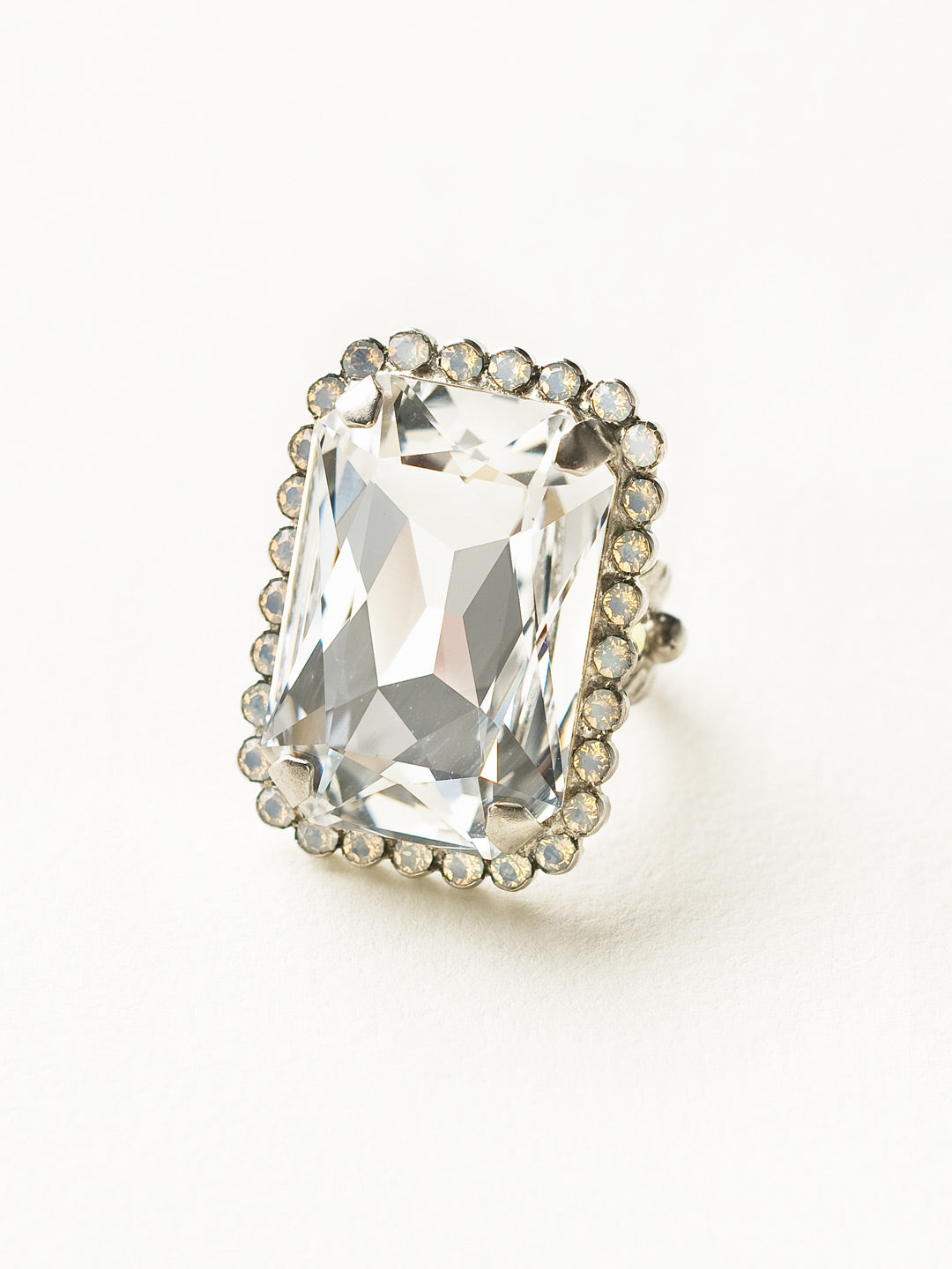 Luxurious Emerald-Cut Cocktail Ring - RBT69ASWBR - <p>Big, bold glamour! The large emerald cut crystal of this cocktail ring will leave all eyes on you! Adjustable to fit ring sizes 6-8. From Sorrelli's White Bridal collection in our Antique Silver-tone finish.</p>