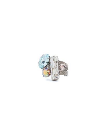 Abstract Cluster Ring - RCF54ASSKY - Available in a variety of colors, this ring showcases abstraction at its finest. Baguette, oval and round cut stones are clustered together at the front and center of this ring and sit atop an double rope designed adjustable band. Exudes style with every angle. From Sorrelli's Sky Blue Peach collection in our Antique Silver-tone finish.