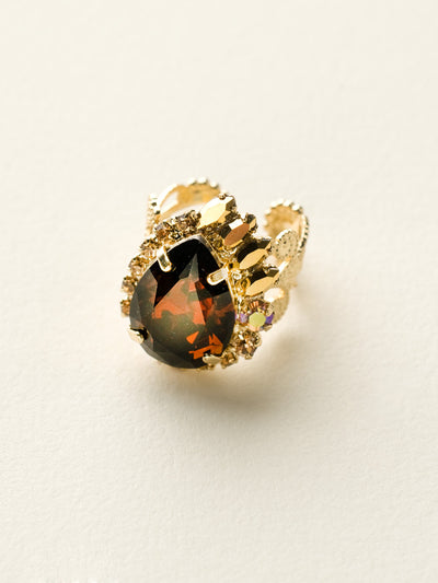 Accented Pear Ring - RCU2BGGOL - A central pear cut stone is accented by slim baguette cut crystals.