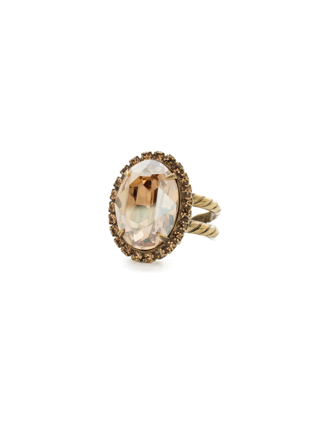 Classic Oval Cut Ring - RDG70AGNT - <p>A jewelry collection must! This glamorous ring features a bold oval cut center crystal surrounded by crystal accents that sits on an adjustable, textured band. An antique-inspired classic. From Sorrelli's Neutral Territory collection in our Antique Gold-tone finish.</p>